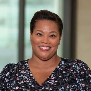 Headshot of Adria Johnson.