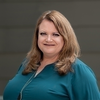 Headshot of Angela Curtis.