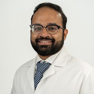 Headshot of Arjun Mahendra.