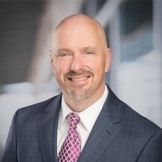 Headshot of John Loyd.