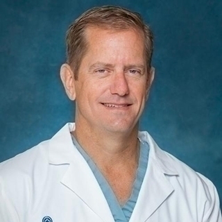 Headshot of John Uecker.