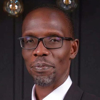Headshot of Thomas Achia.
