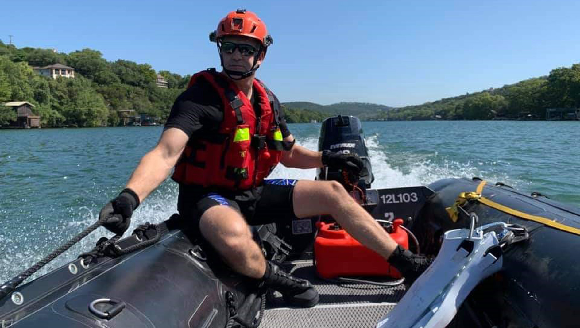 Jason Pickett on EMS duty riding in a boat.