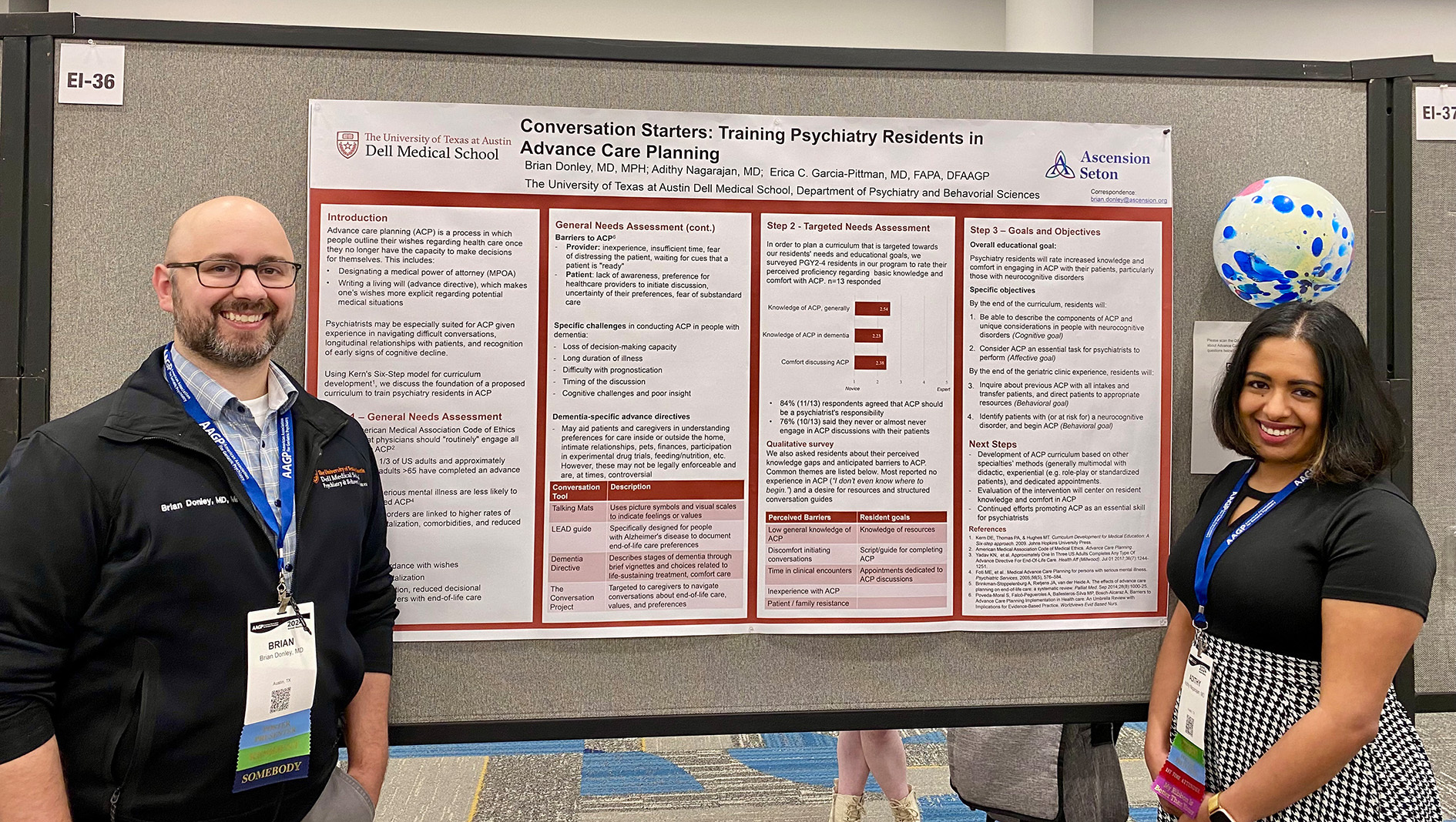 Two members of the Geriatric Psychiatry Fellowship stand next to a research poster.