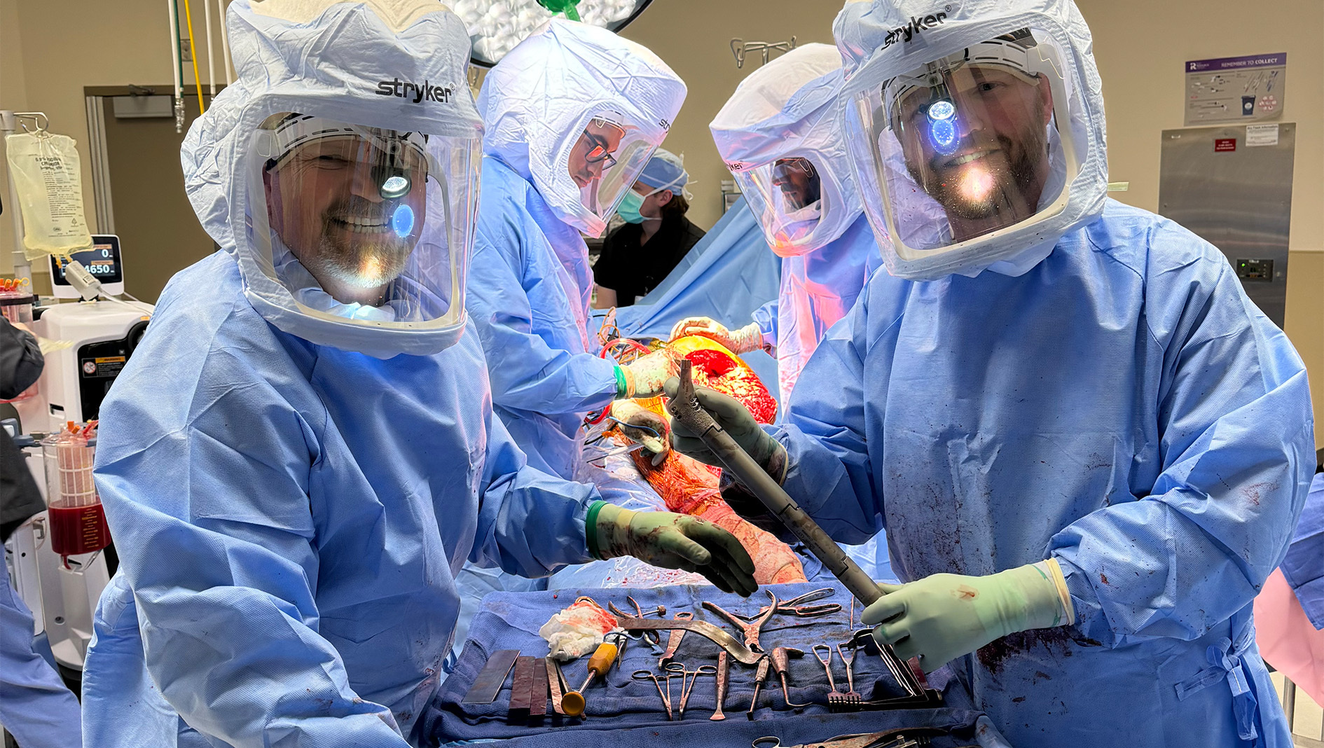 Members of the orthopaedic surgery fellowship pose for a photo inside the operating room during a training activity,