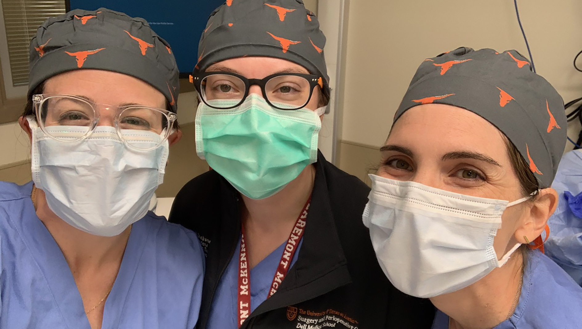 Group photo of fellows wearing masks in a clinical setting