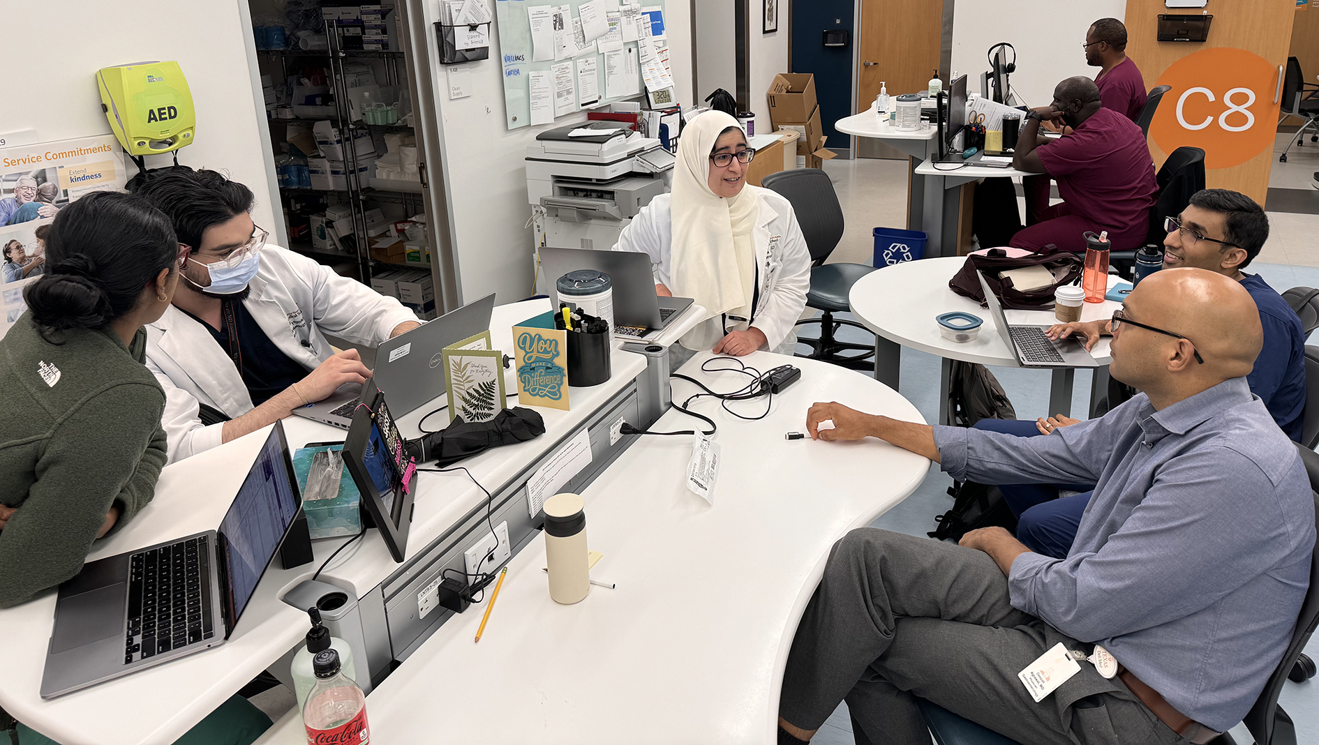 Gastroenterology fellows consult with each other.