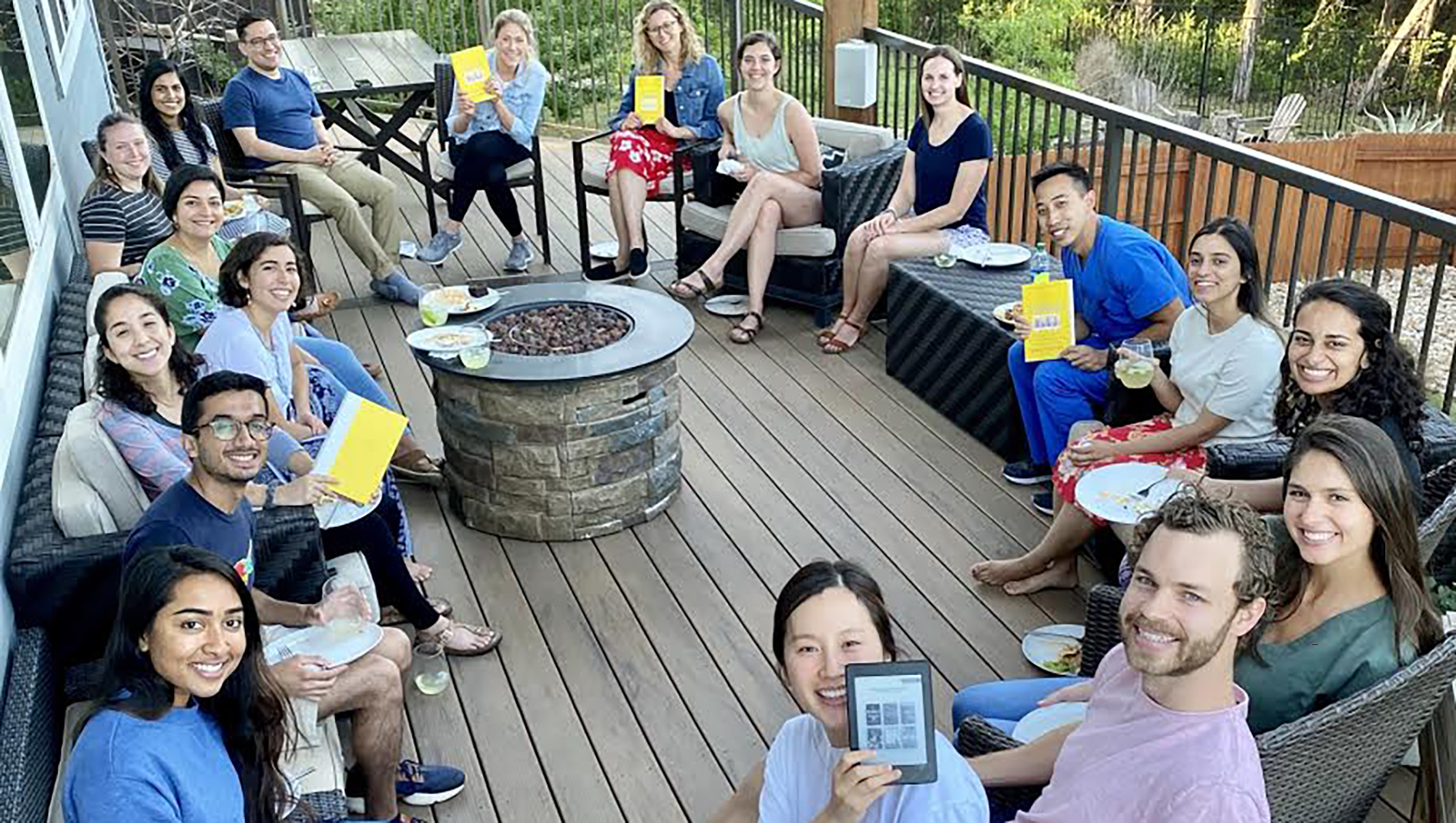 Group photo of pediatric residents sitting outside during book club