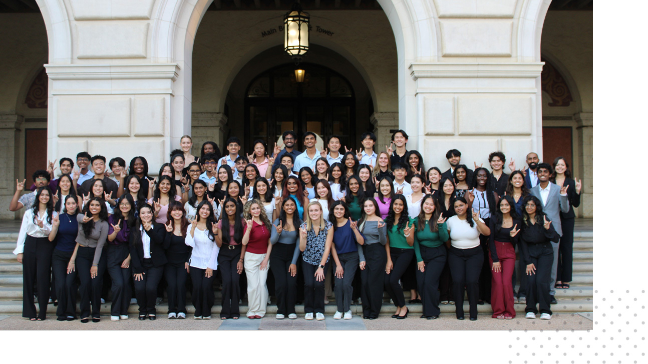 Members of the Health Leadership Apprentice Program stand for a group photo on the UT Austin campus.
