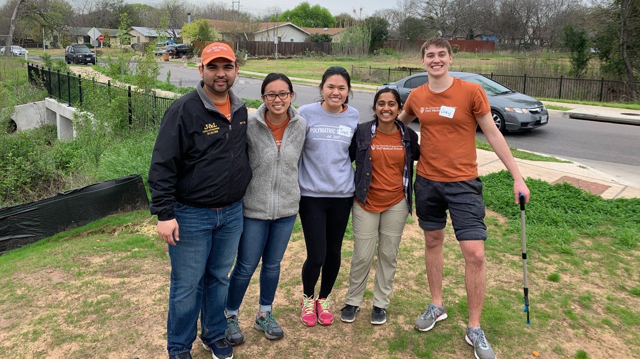 The Orange House team members smiling in a group.