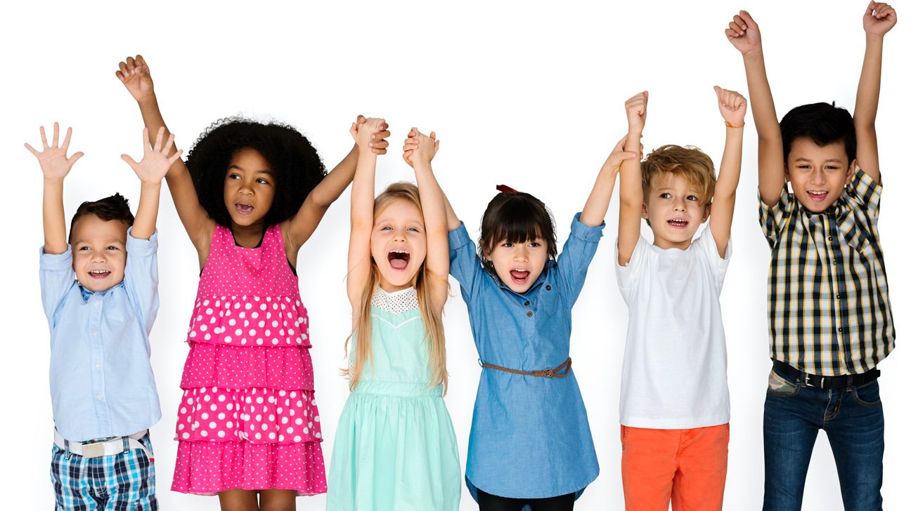 Stock image of six young children throwing their hands in the air in glee.