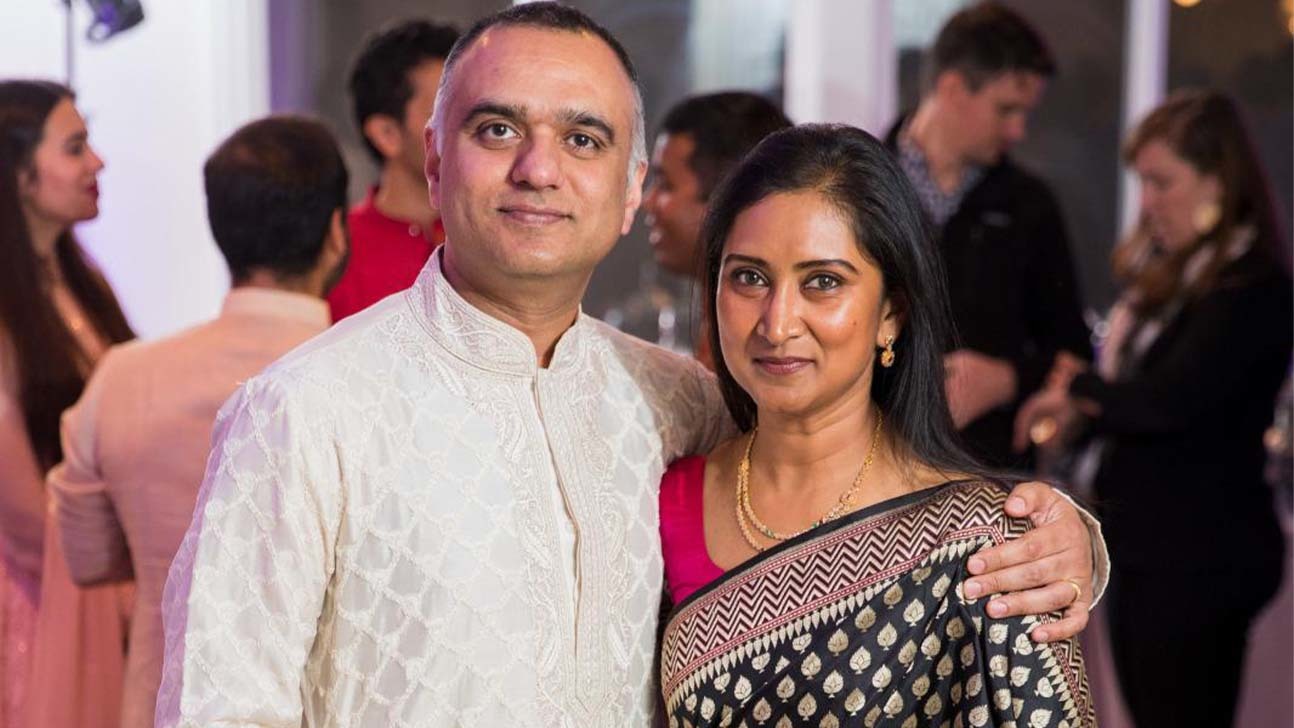 Dheeraj and Swapna Pandey standing side by side.