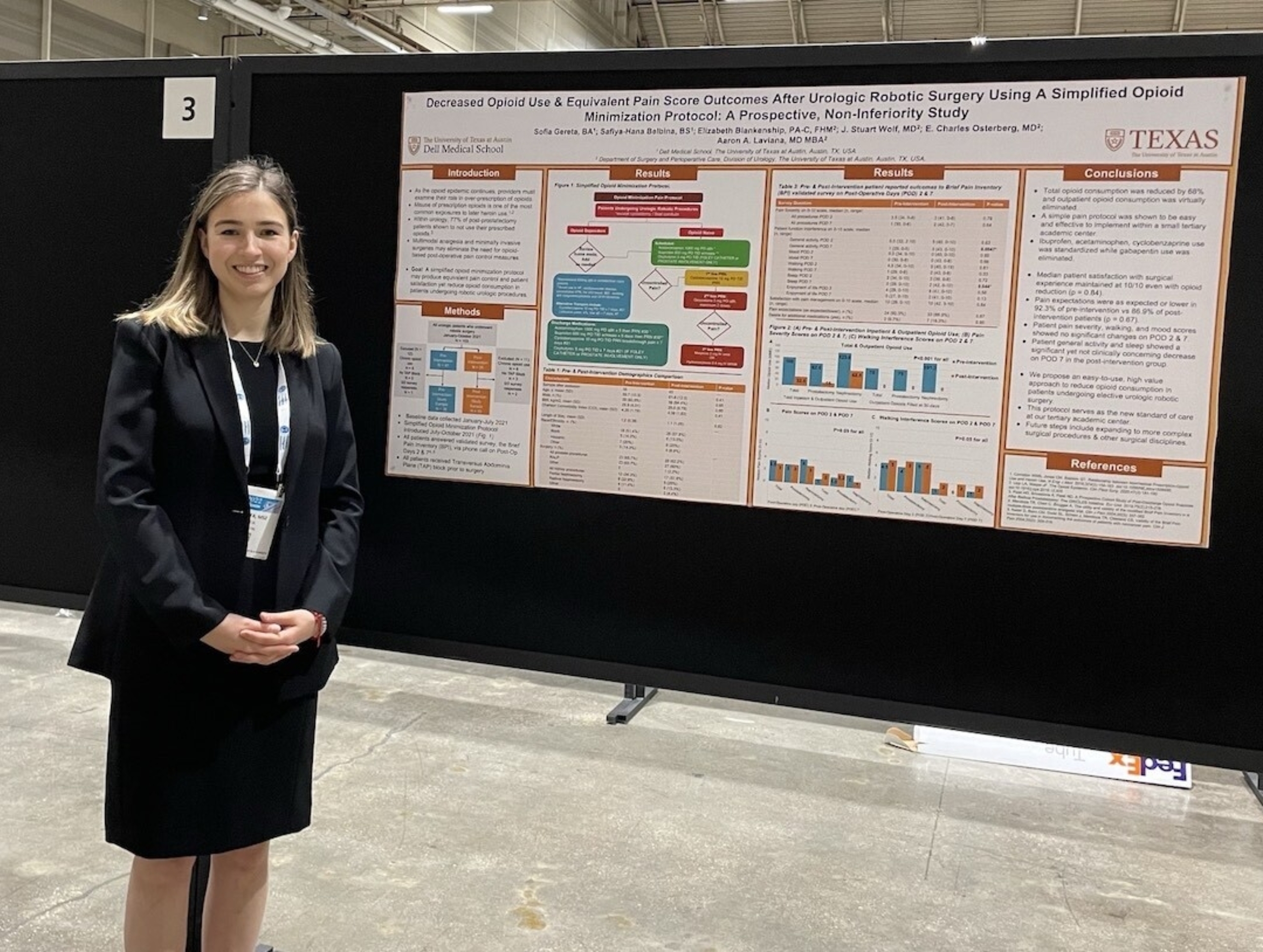 Sofia Gereta stands in front of a research poster.