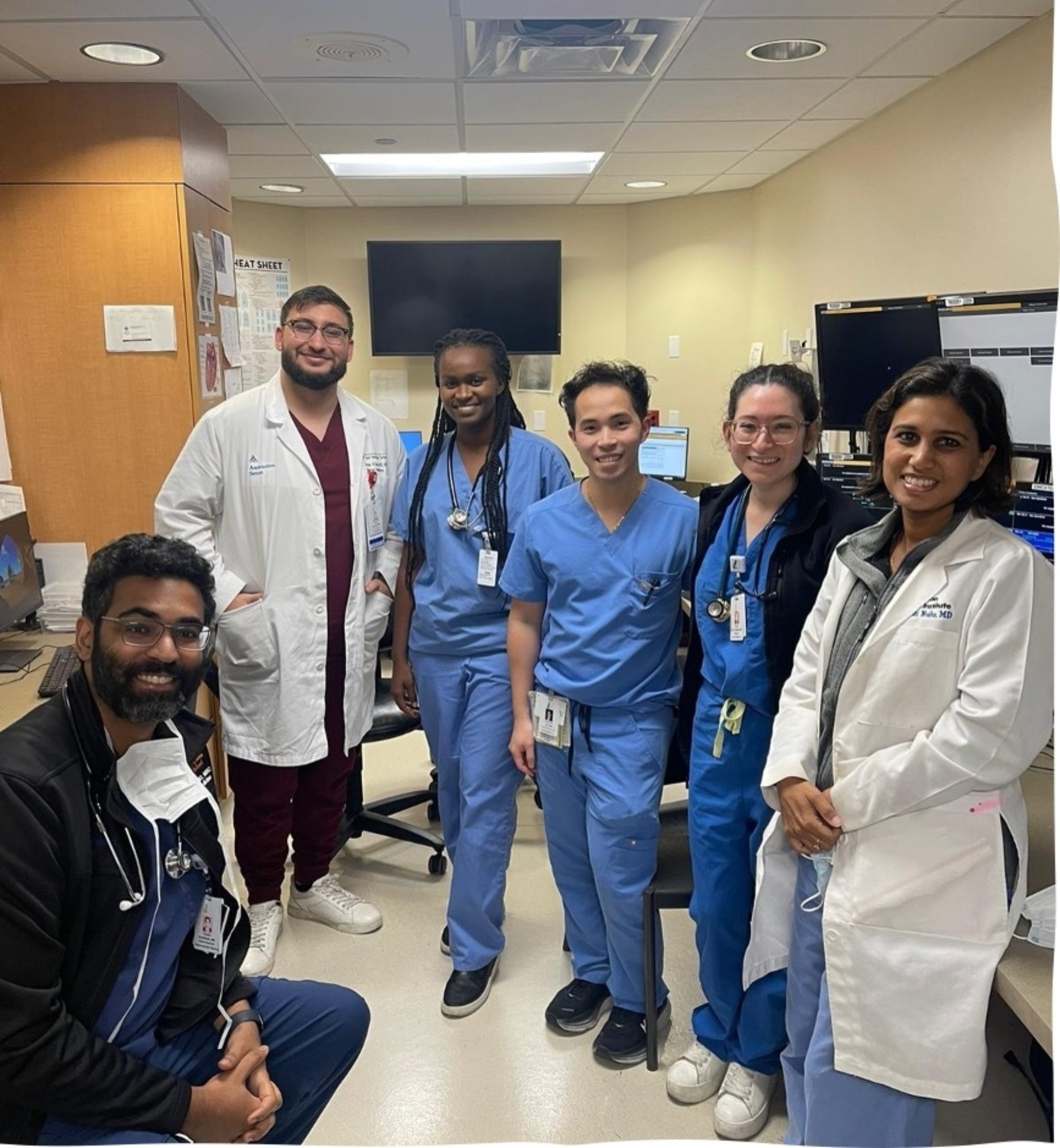 International exchange students from Kenya stand together for a picture with Dell Med students and trainees.