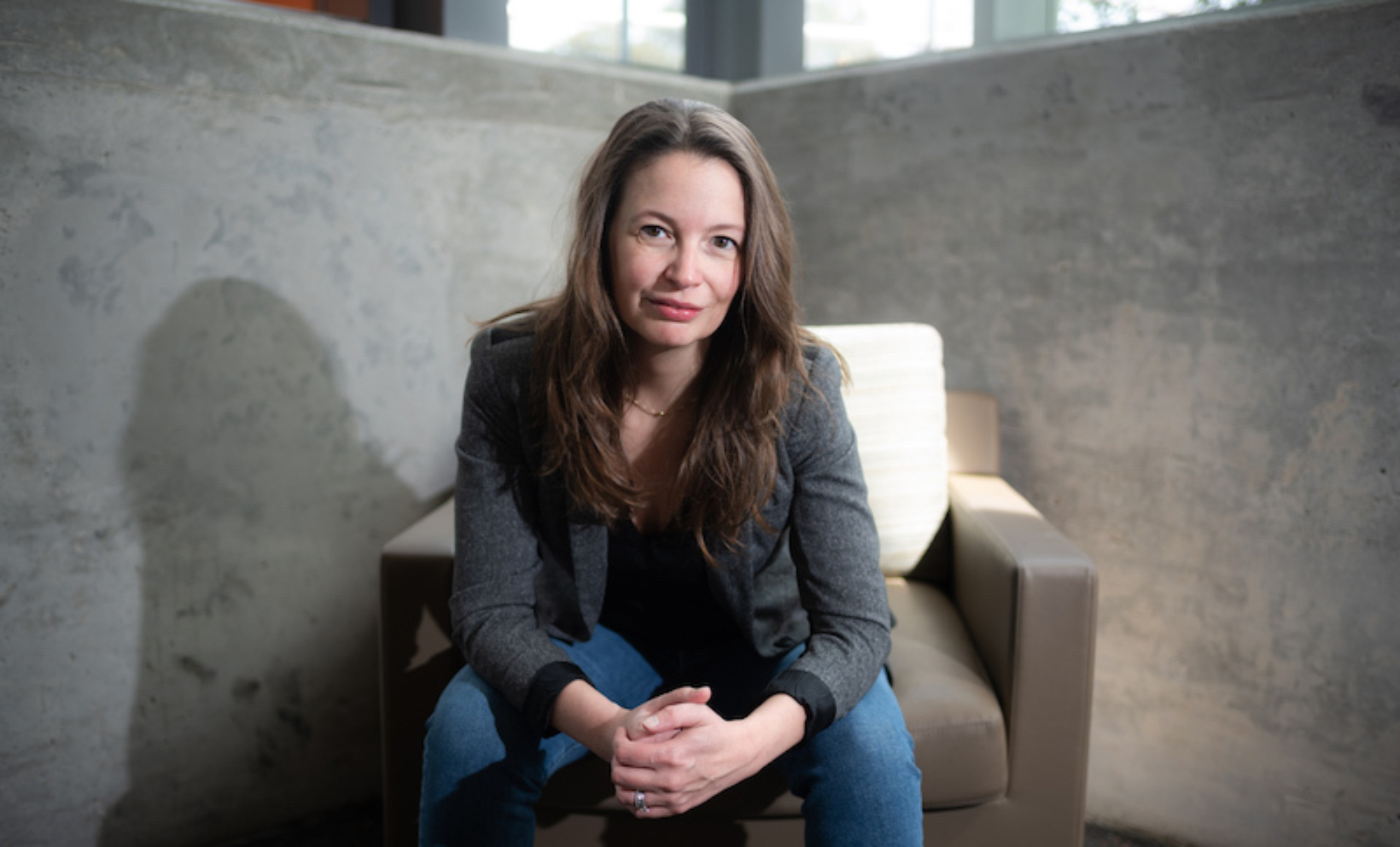 Marissa Burgermaster sits for a portrait inside the Dell Medical School campus.