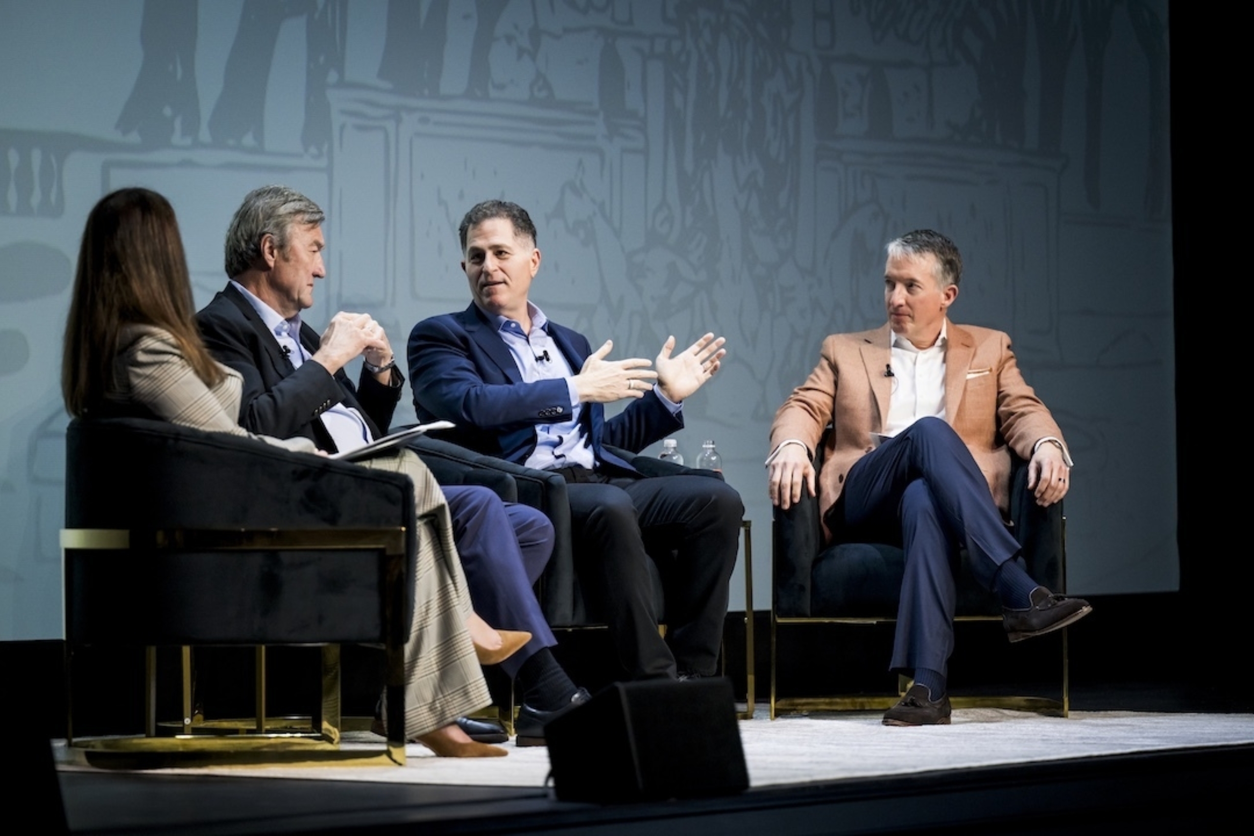 From left to right: Claudia Lucchinetti, John Noseworthy, Michael Dell and Jay Hartzell sit in chairs on the stage of the Hogg Auditorium for a conversation.
