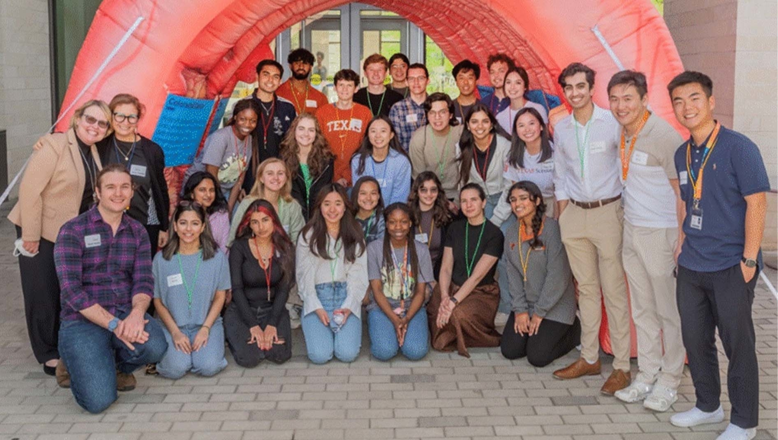 Participants from the Cancer Genomics SPRINT event gather for a group photo outside the Dell Medical School campus.