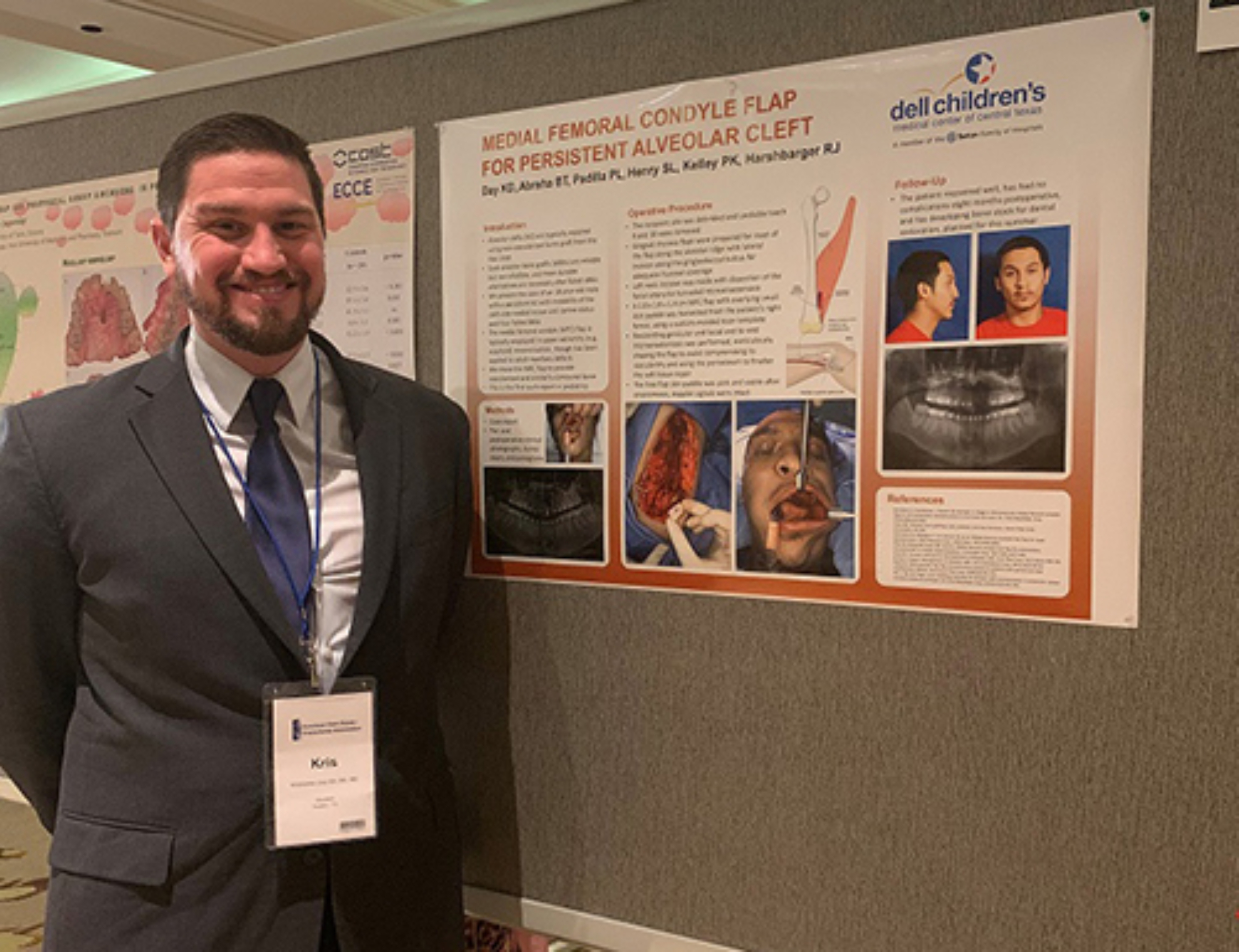 Male resident presenting his research poster.