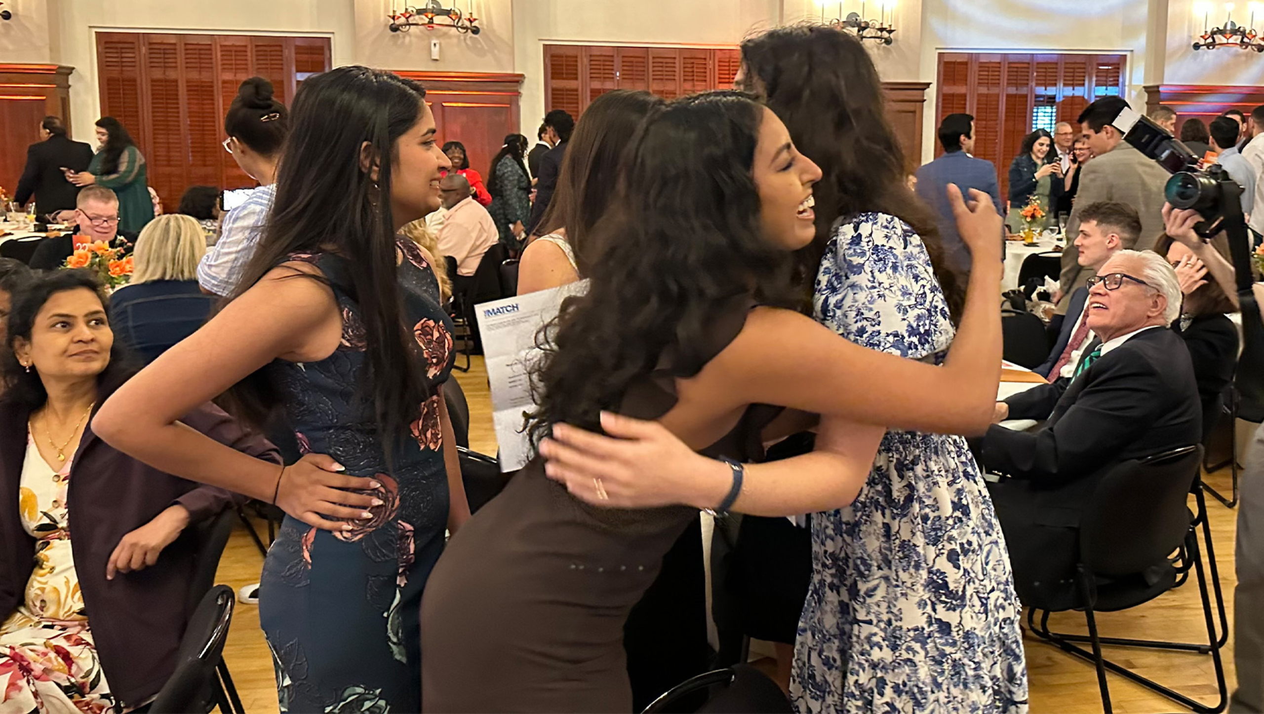 A Dell Med student celebrates her Match Day result with hugs.