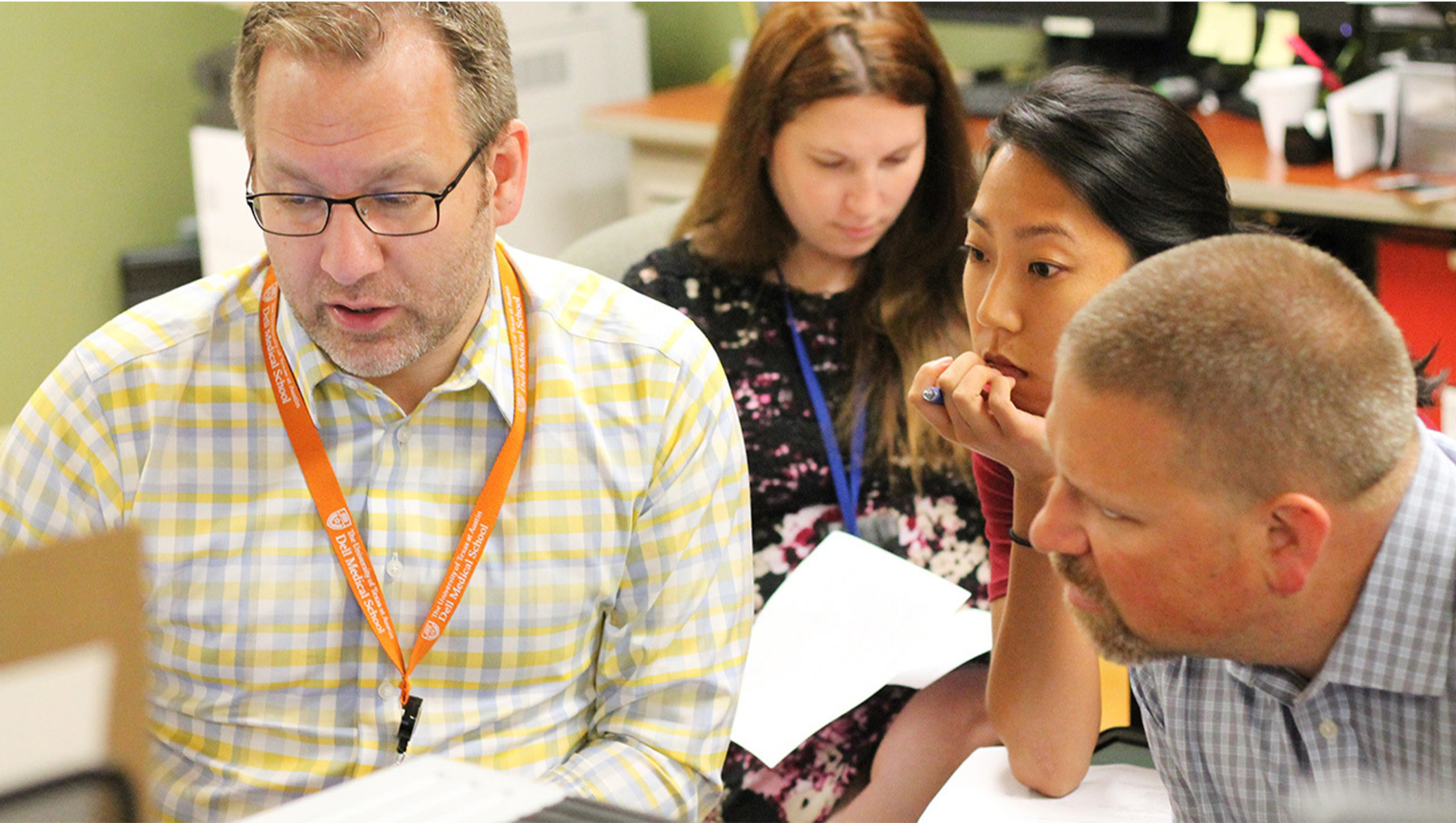 The Musculoskeletal Institute care team reviews X-rays of a patient.