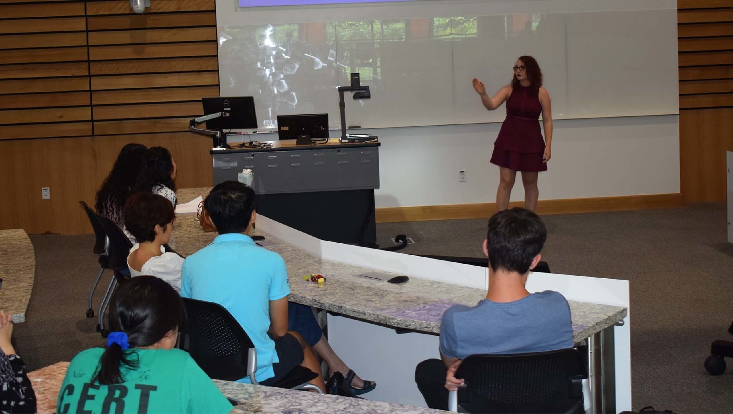 A lecturer facilitating a discussion for one of Dell Med's youth programs.