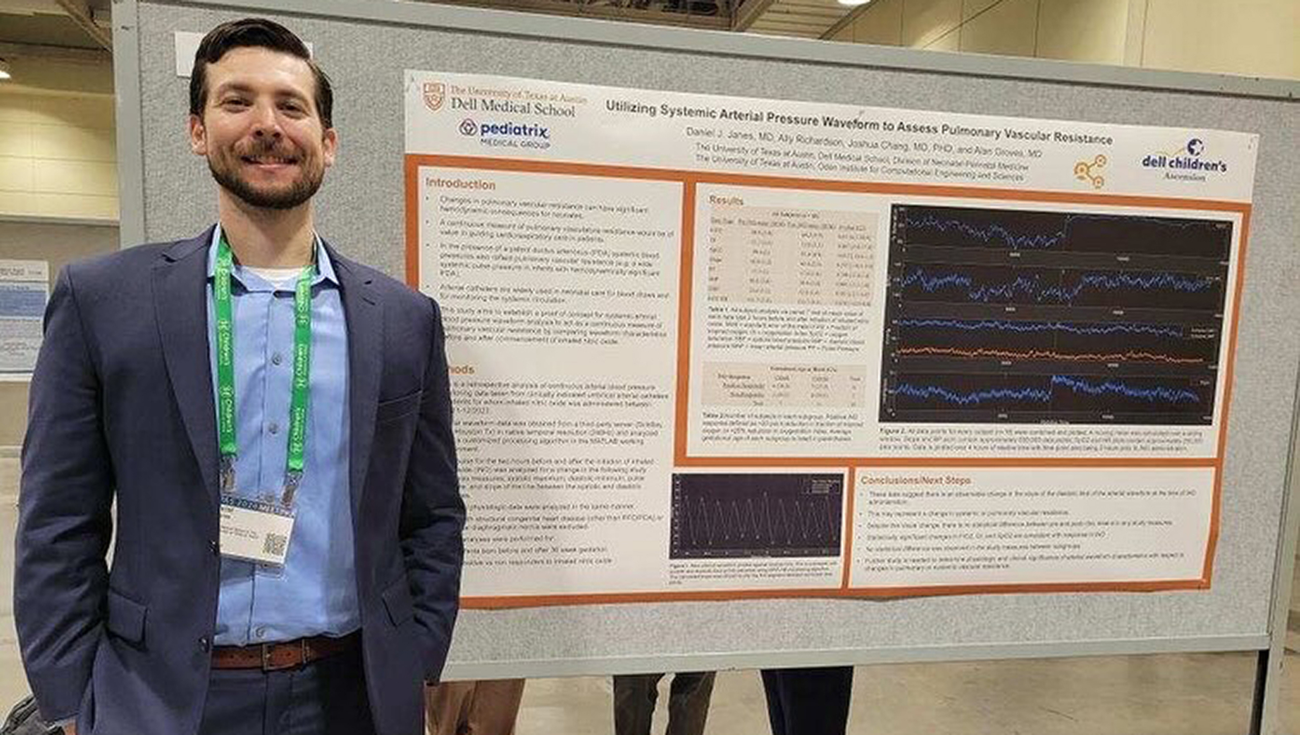 A NICU fellow presents his research poster.