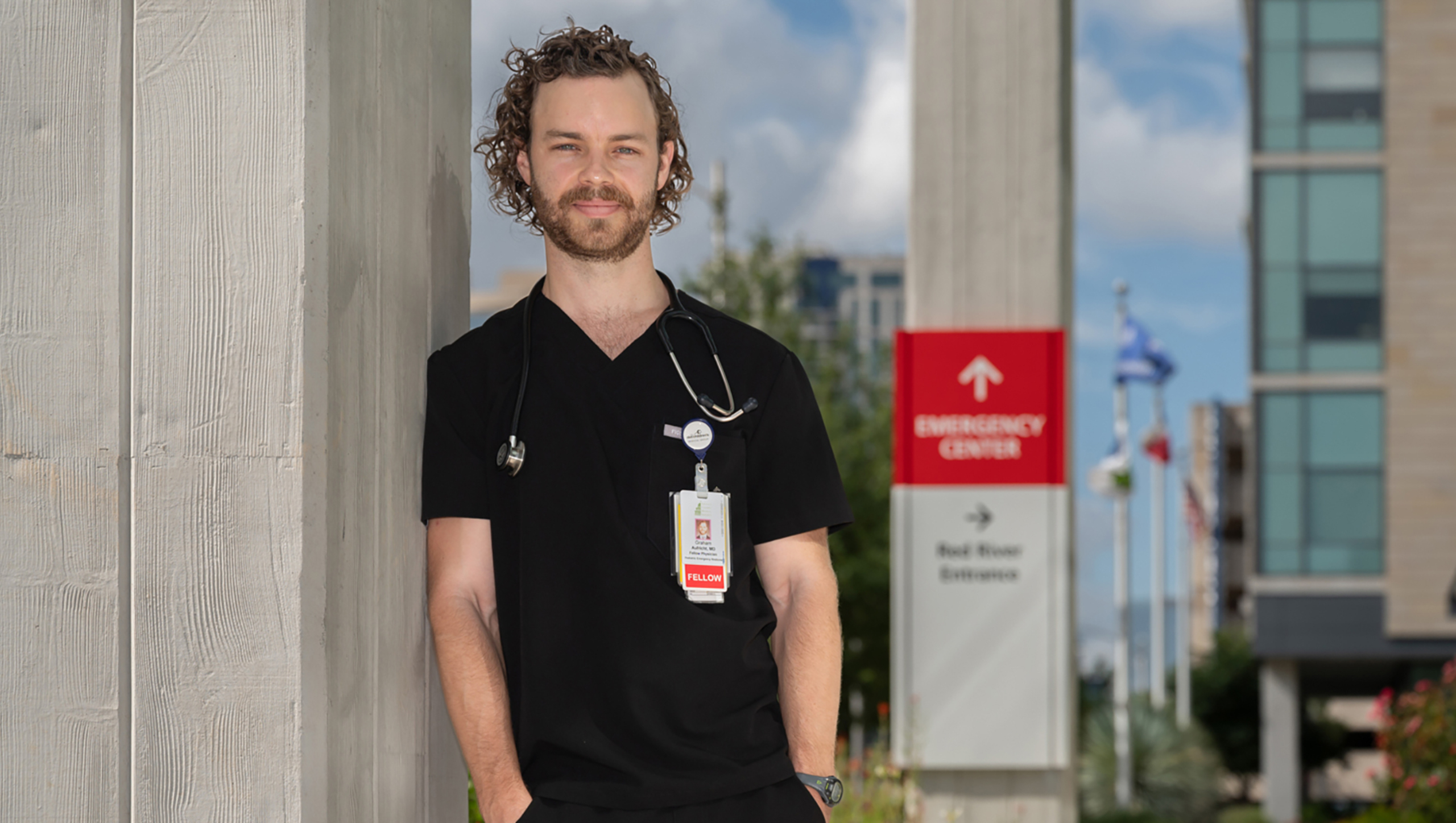 Portrait of Graham Aufricht outside of Dell Seton Medical Center's emergency center.